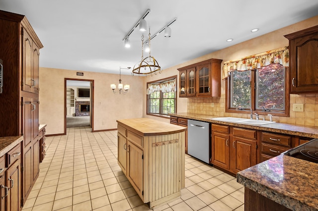 275 S Bluffwood Ter, Saint Joseph, MI 49085 - kitchen with stainless steel dishwasher, a sink, wood counters, backsplash, and recessed lighting