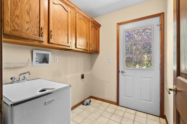 275 S Bluffwood Ter, Saint Joseph, MI 49085 - laundry area featuring cabinet space, washer hookup, hookup for an electric dryer, and baseboards