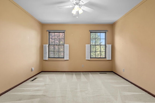275 S Bluffwood Ter, Saint Joseph, MI 49085 - spare room featuring carpet, baseboards, ornamental molding, and ceiling fan