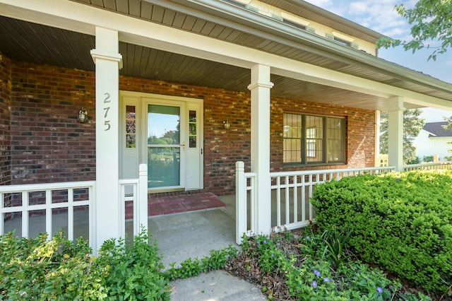 275 S Bluffwood Ter, Saint Joseph, MI 49085 - property entrance featuring covered porch and brick siding