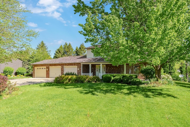 275 S Bluffwood Ter, Saint Joseph, MI 49085 - view of front facade with an attached garage, brick siding, driveway, and a front lawn