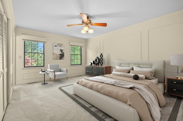 275 S Bluffwood Ter, Saint Joseph, MI 49085 - bedroom with a decorative wall, light carpet, and a ceiling fan