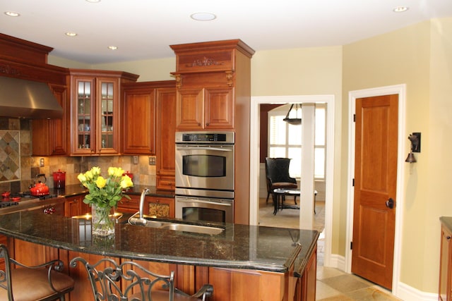 60 Timber Ridge Ct, Milan, MI 48160 - kitchen with double oven, range hood, decorative backsplash, recessed lighting, and glass insert cabinets