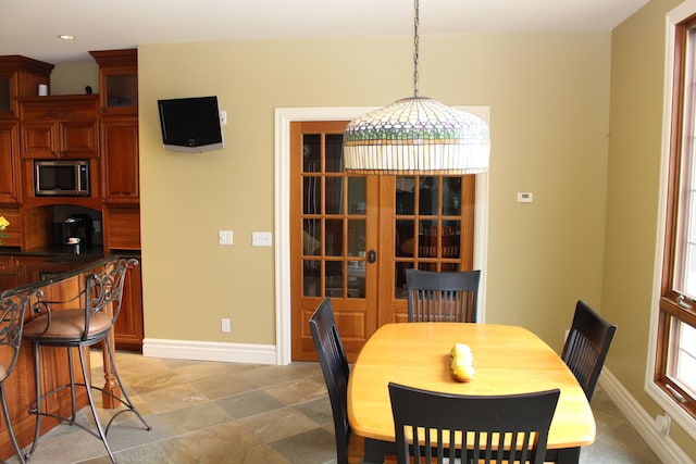 60 Timber Ridge Ct, Milan, MI 48160 - dining room featuring recessed lighting and light stone finish flooring