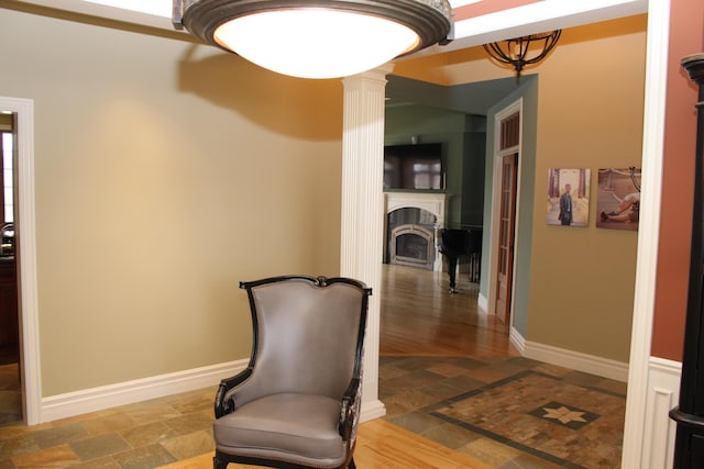 60 Timber Ridge Ct, Milan, MI 48160 - unfurnished room with stone tile floors, a fireplace, and a chandelier