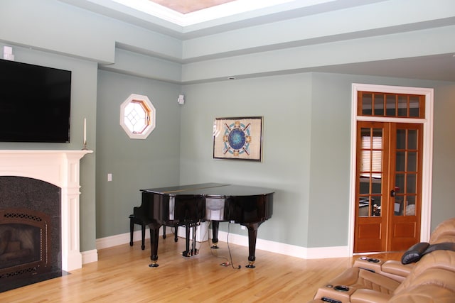60 Timber Ridge Ct, Milan, MI 48160 - living area with wood finished floors and a fireplace with flush hearth