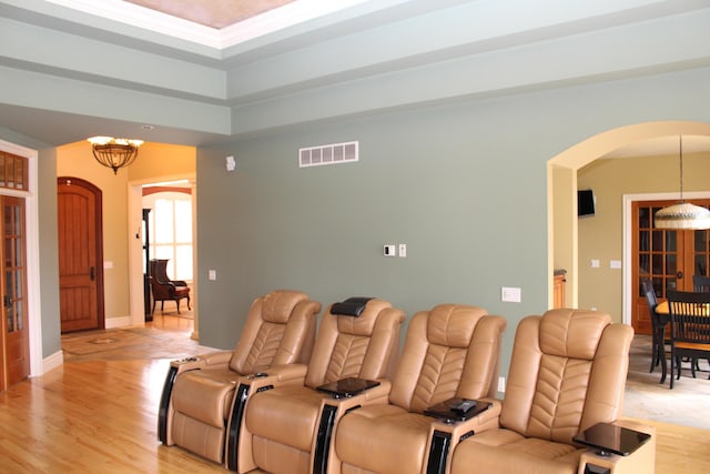 60 Timber Ridge Ct, Milan, MI 48160 - cinema room with arched walkways, light wood-type flooring, and a chandelier