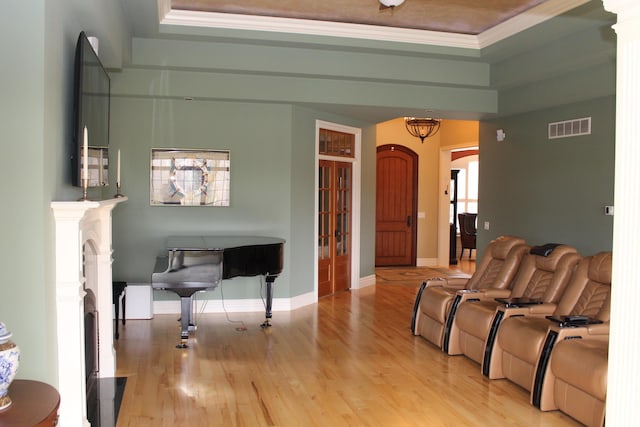 60 Timber Ridge Ct, Milan, MI 48160 - living room featuring a raised ceiling, light wood finished floors, ornamental molding, and arched walkways