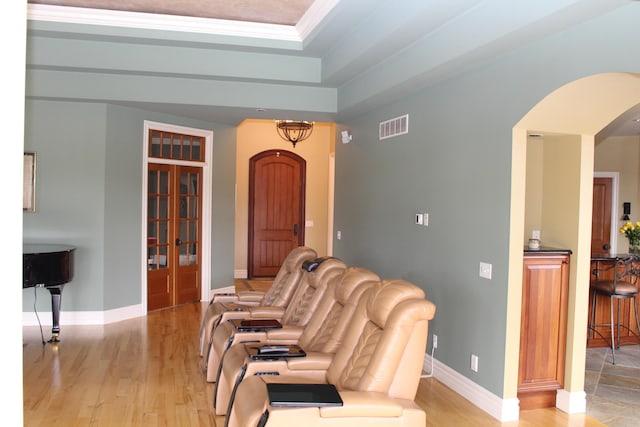 60 Timber Ridge Ct, Milan, MI 48160 - living area with arched walkways, light wood-type flooring, a tray ceiling, and ornamental molding