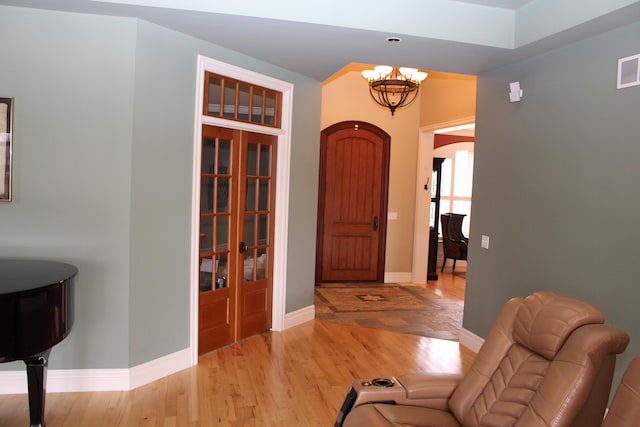 60 Timber Ridge Ct, Milan, MI 48160 - foyer entrance featuring a chandelier and light wood-type flooring