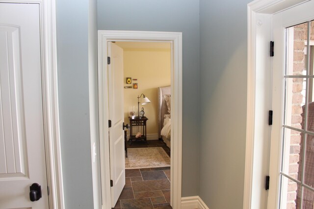 60 Timber Ridge Ct, Milan, MI 48160 - corridor featuring stone finish floors and baseboards