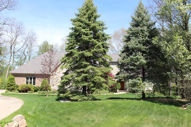 60 Timber Ridge Ct, Milan, MI 48160 - view of front of house featuring a front lawn and brick siding