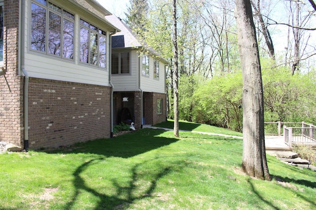 60 Timber Ridge Ct, Milan, MI 48160 - view of property exterior featuring brick siding and a lawn