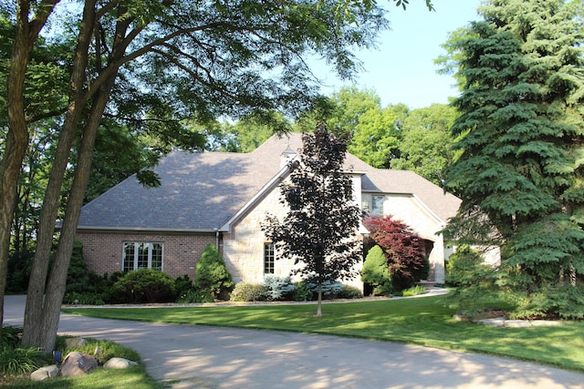 60 Timber Ridge Ct, Milan, MI 48160 - view of front of house featuring a front lawn and brick siding