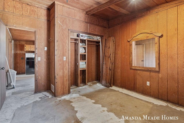 12345 92nd St SE, Alto, MI 49302 - interior space with wooden walls, wooden ceiling, freestanding refrigerator, and a closet