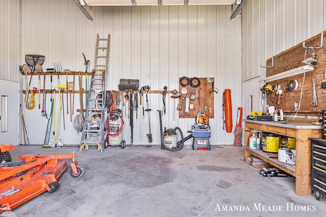 12345 92nd St SE, Alto, MI 49302 - garage featuring a workshop area