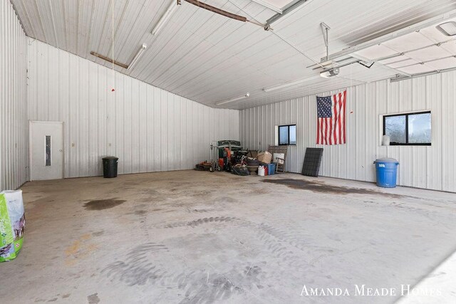 12345 92nd St SE, Alto, MI 49302 - garage with a garage door opener