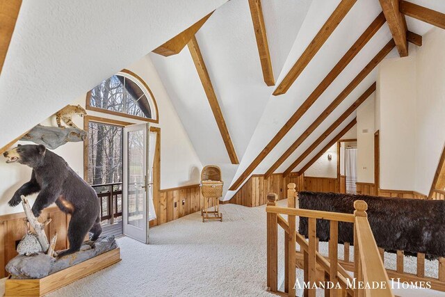 12345 92nd St SE, Alto, MI 49302 - additional living space featuring wooden walls, vaulted ceiling with beams, carpet, and wainscoting