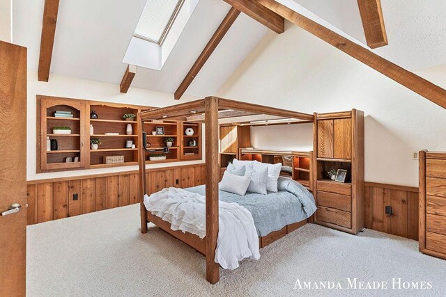12345 92nd St SE, Alto, MI 49302 - bedroom featuring beam ceiling, wood walls, carpet, a wainscoted wall, and a skylight