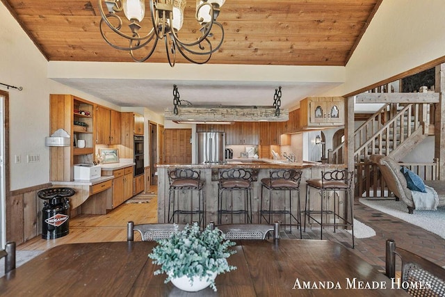 12345 92nd St SE, Alto, MI 49302 - dining room with an inviting chandelier, light wood-style flooring, lofted ceiling, and wooden ceiling