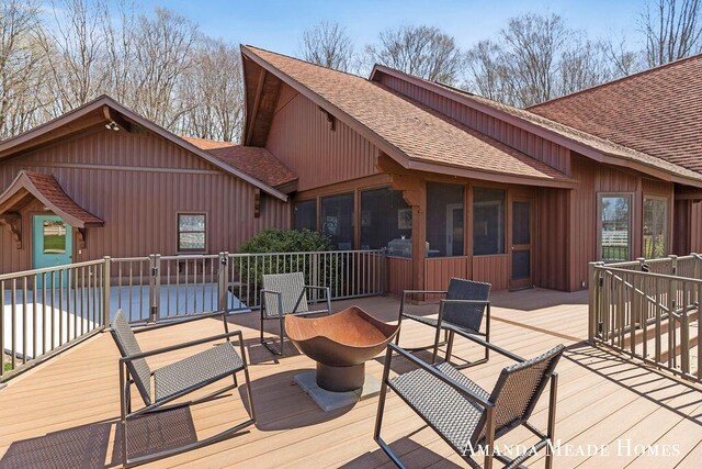 12345 92nd St SE, Alto, MI 49302 - wooden deck featuring a sunroom