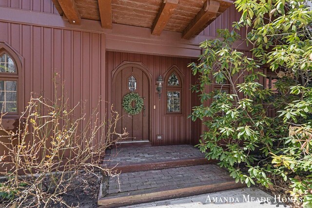 12345 92nd St SE, Alto, MI 49302 - doorway to property with board and batten siding