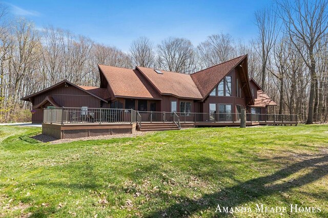 12345 92nd St SE, Alto, MI 49302 - rear view of house featuring a lawn, a wooden deck, and a shingled roof