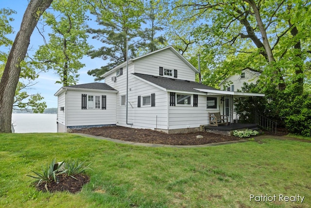 1266 E 88th St, Newaygo, MI 49337 - view of home's exterior with a lawn and roof with shingles
