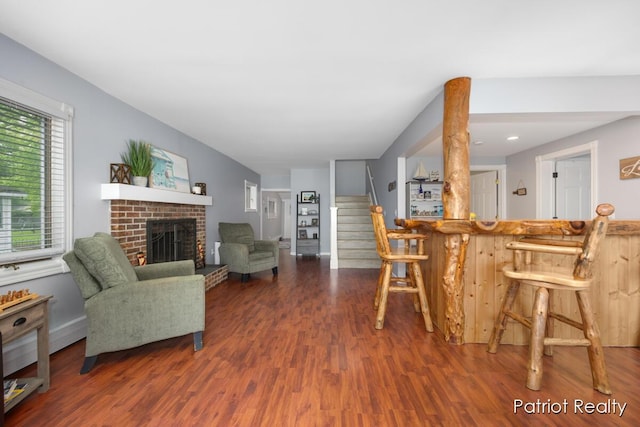1266 E 88th St, Newaygo, MI 49337 - living room featuring wood finished floors, a fireplace, and stairs