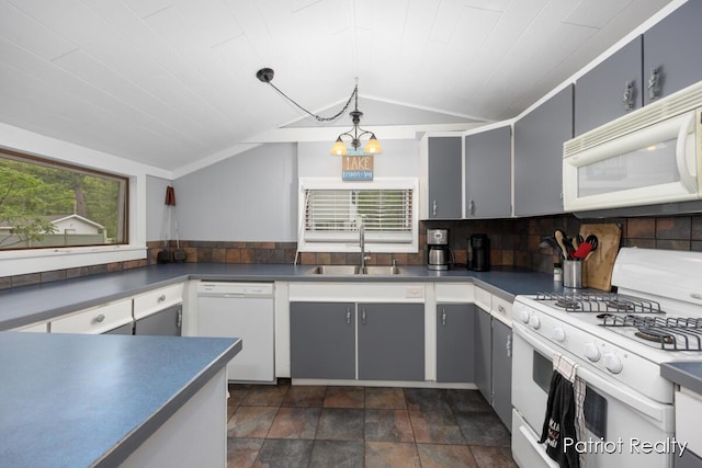 1266 E 88th St, Newaygo, MI 49337 - kitchen featuring white appliances, a sink, lofted ceiling, gray cabinets, and a chandelier