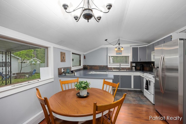 1266 E 88th St, Newaygo, MI 49337 - dining room with a chandelier and lofted ceiling