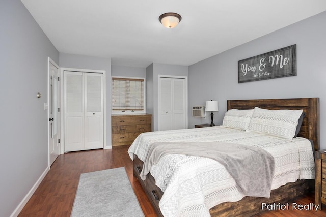 1266 E 88th St, Newaygo, MI 49337 - bedroom with multiple closets, wood finished floors, baseboards, and a wall mounted air conditioner