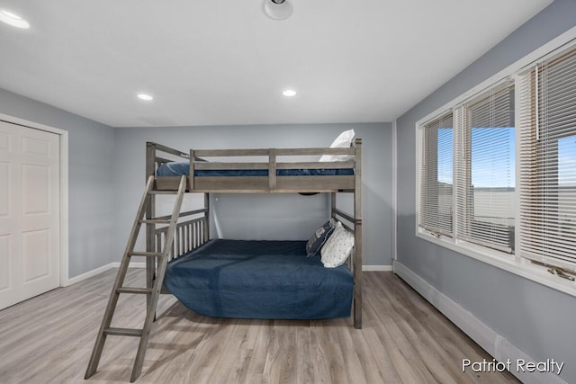 1266 E 88th St, Newaygo, MI 49337 - bedroom with wood finished floors, baseboards, and recessed lighting