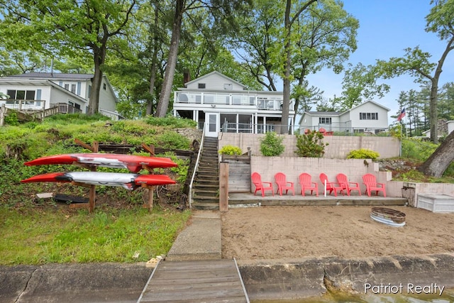 1266 E 88th St, Newaygo, MI 49337 - rear view of house with stairway and a balcony