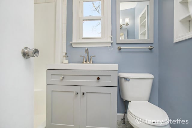 bathroom featuring vanity and toilet