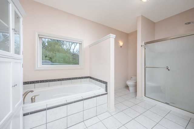 18559 Kreig Dr, Big Rapids, MI 49307 - full bath with tile patterned floors, a stall shower, toilet, and a garden tub
