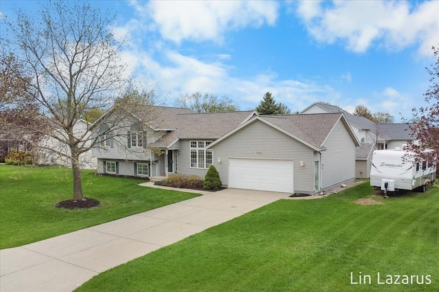 6332 Rush Creek Ct, Hudsonville, MI 49426 - split level home featuring an attached garage, a shingled roof, driveway, and a front yard