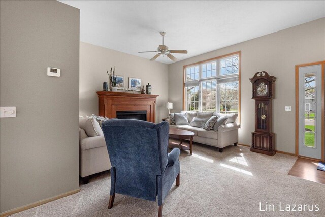 6332 Rush Creek Ct, Hudsonville, MI 49426 - living room featuring a ceiling fan, baseboards, light colored carpet, and a fireplace