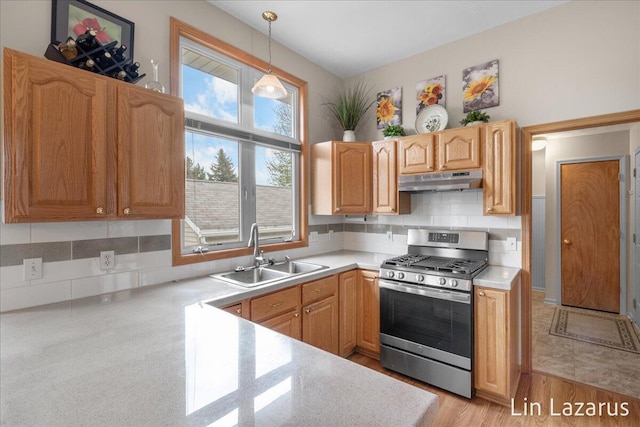 6332 Rush Creek Ct, Hudsonville, MI 49426 - kitchen featuring light countertops, a sink, and gas range
