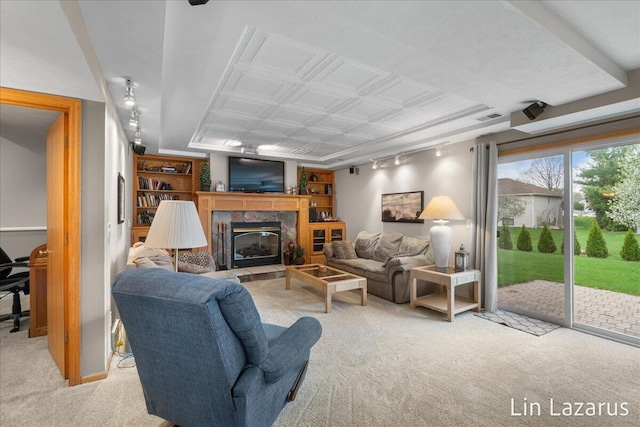 6332 Rush Creek Ct, Hudsonville, MI 49426 - living area featuring a glass covered fireplace, an ornate ceiling, light carpet, and rail lighting