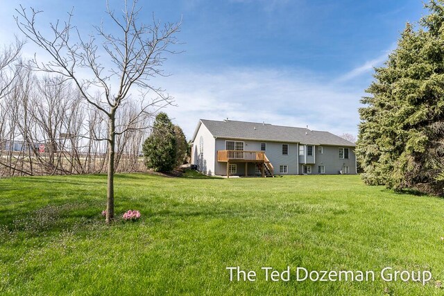 45 Trillium Ct, Holland, MI 49423 - view of yard featuring stairs and a deck