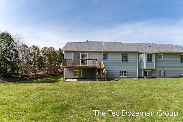 45 Trillium Ct, Holland, MI 49423 - back of house featuring a lawn, a wooden deck, and stairway