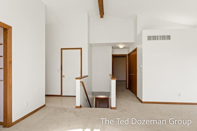 45 Trillium Ct, Holland, MI 49423 - hallway featuring visible vents, carpet, baseboards, and beam ceiling