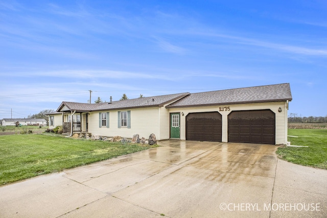single story home featuring a garage, a front lawn, roof with shingles, and concrete driveway