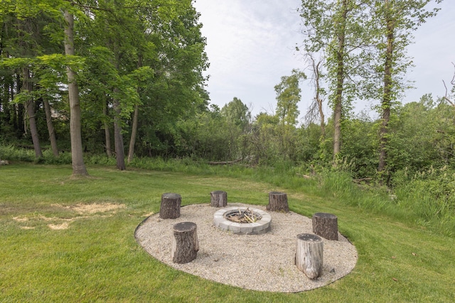 270 Fairway View Dr, Oxford, MI 48371 - view of grassy yard with a fire pit