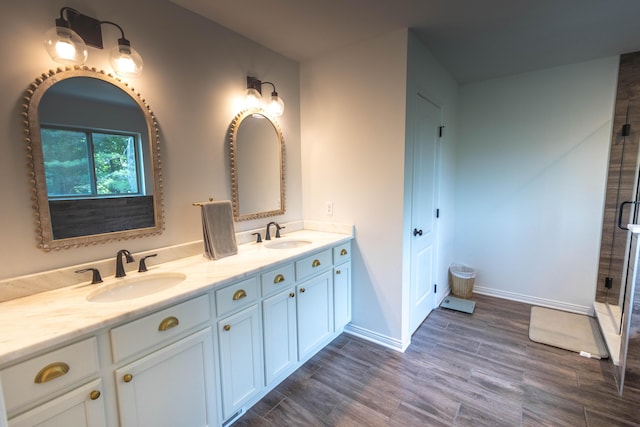 270 Fairway View Dr, Oxford, MI 48371 - full bathroom with double vanity, wood finished floors, and a shower stall