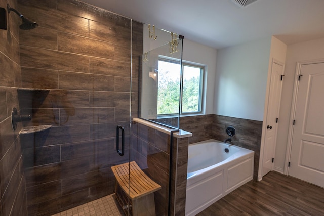 270 Fairway View Dr, Oxford, MI 48371 - full bath featuring a stall shower, a bath, and wood finished floors