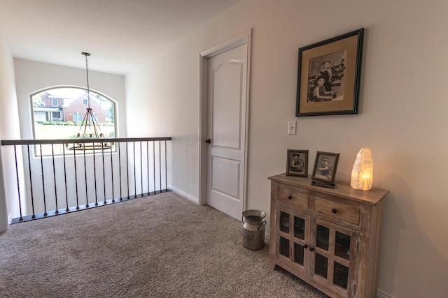 270 Fairway View Dr, Oxford, MI 48371 - hall featuring carpet flooring and a chandelier