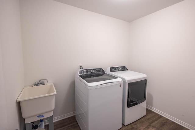 270 Fairway View Dr, Oxford, MI 48371 - laundry area with washer and clothes dryer and dark wood finished floors