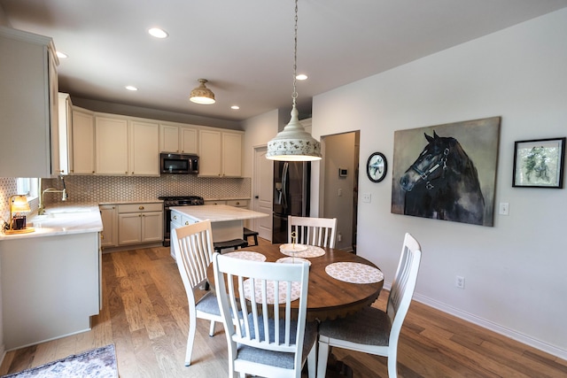 270 Fairway View Dr, Oxford, MI 48371 - dining area with light wood-style floors and recessed lighting